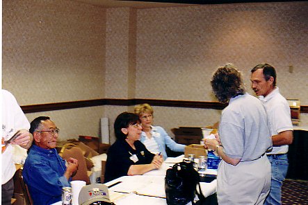 Registration, Norm Nishikubo, his wife,unknown,back to camera is Cathy Groves